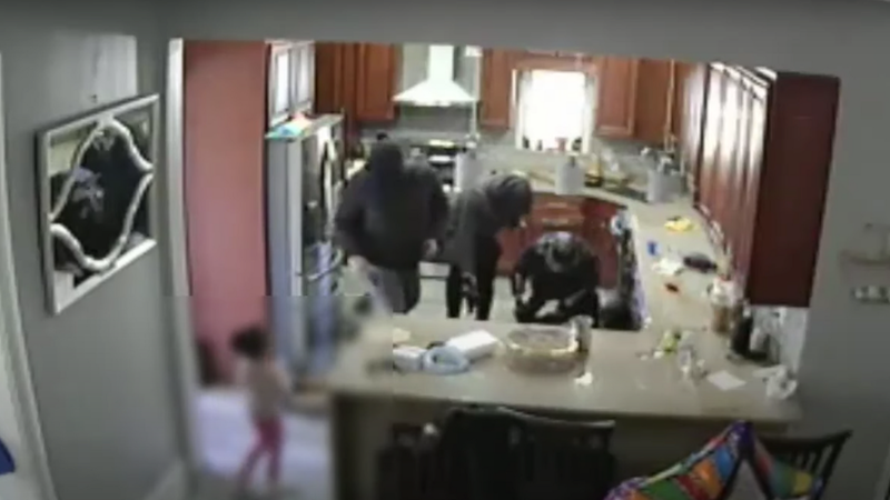 Police: Armed robbers break into home, tie up family as young child watches, video shows