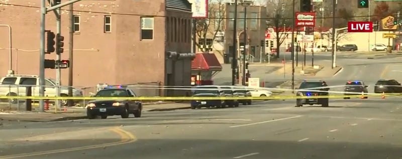 Crime scene tape surrounds the site of a homicide in Kansas City.