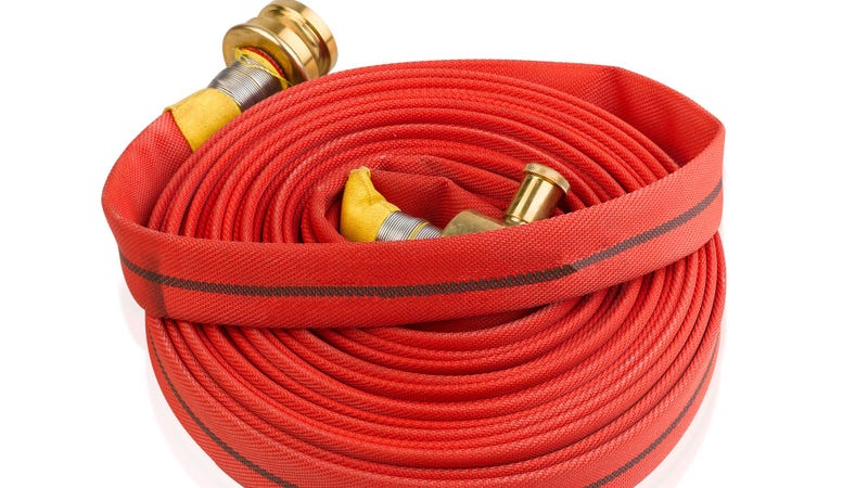 Fire hose soft extension pipe isolated - stock photo