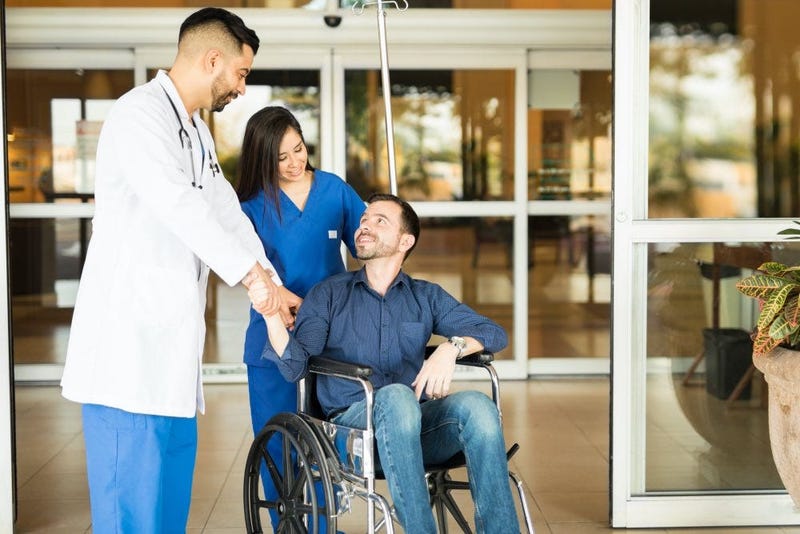 patient and doctors leaving hospital