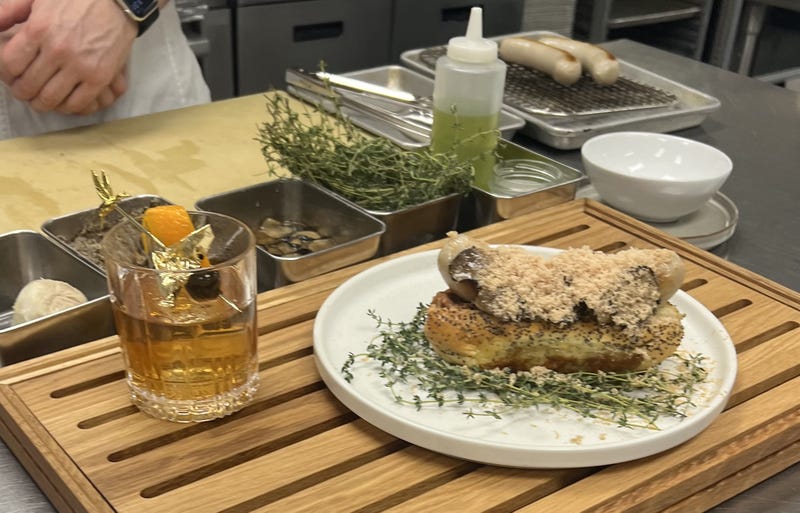 hot dog and cocktail on tray