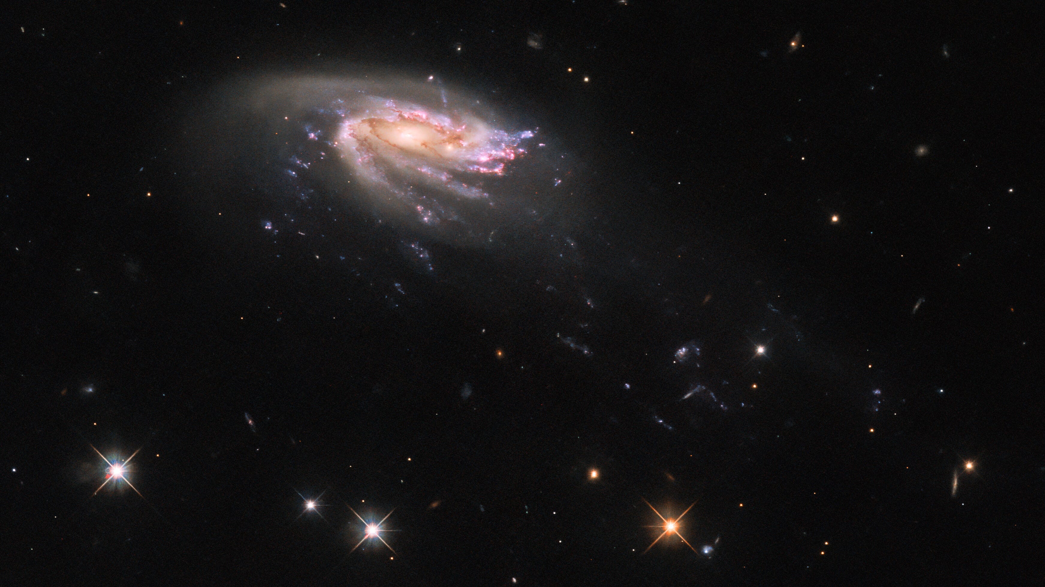Hubble discovers stunning jellyfish galaxy 'swimming' through a sea of stars