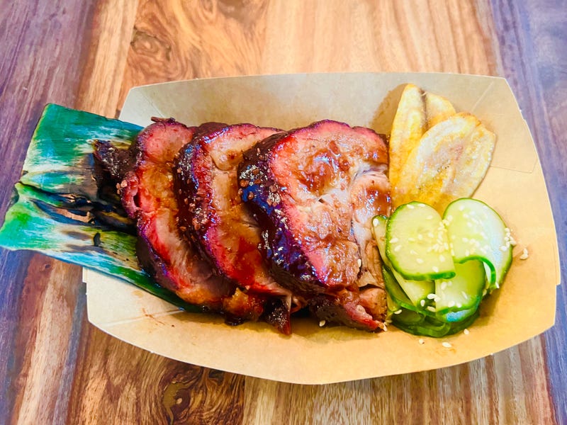 Hula Kalua Pork, slow-smoked pork collar caramelized with Hawaiian barbecue sauce, inspired by the flavors of traditional Hawaiian Kalua pork from RC's BBQ.