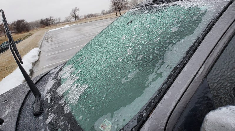 Photograph of a car in Platte County, Missouri that is covered in ice. 