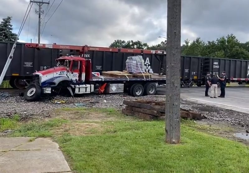 Emergency crews are at the scene of a major Downriver collision after a train rammed into a semi-truck early Friday morning.
