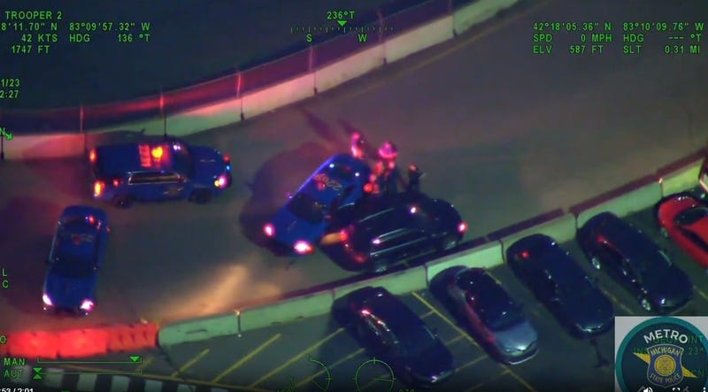 A shootout between families following a heated child custody hearing ended with two people and a business struck by gunfire and vehicle crashing into an Eastpointe restaurant.