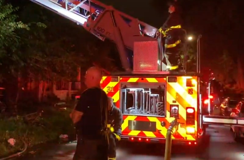 A woman managed to get her father to safety on Wednesday morning after their home and two others went up in flames on Detroit's east side.