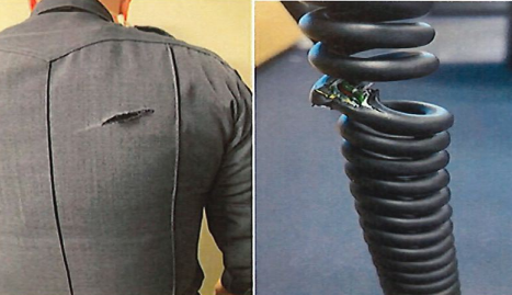 One shot grazed the back of an officer’s uniform, and another struck his radio cord.