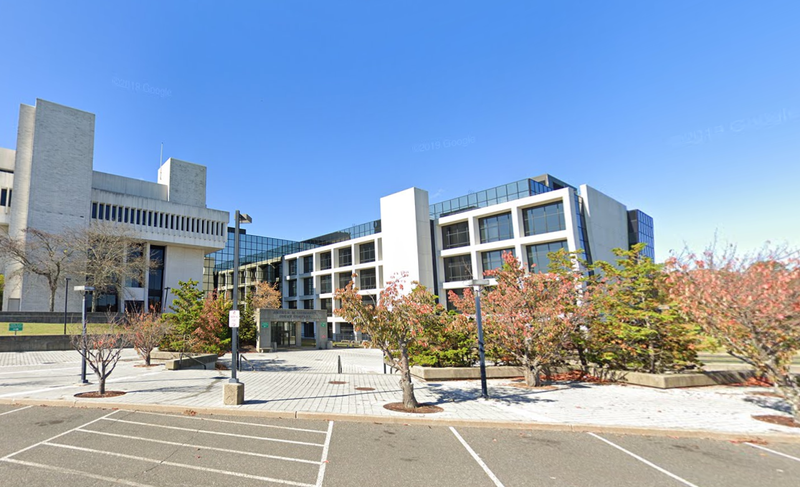 One of the suspects was arrested at Arthur M. Cromarty Court Complex building in Riverhead, Long Island.