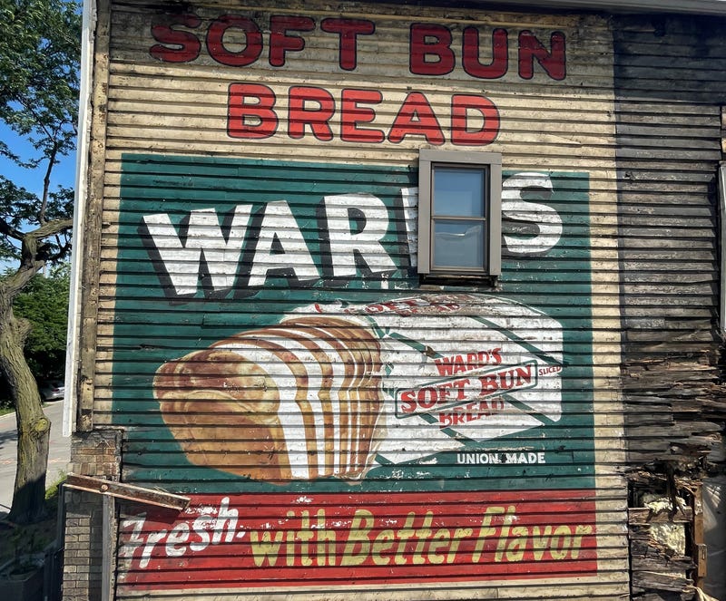 A colorful, hand-painted advertisement for bread