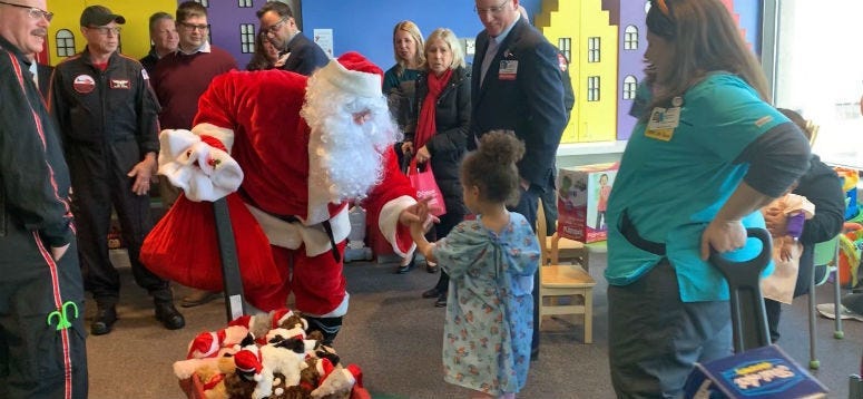 Santa visits patients at Cooper Hospital.