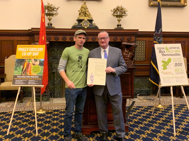 Jon Roesser, general manager of Weaver’s Way co-op, with Mayor Jim Kenney