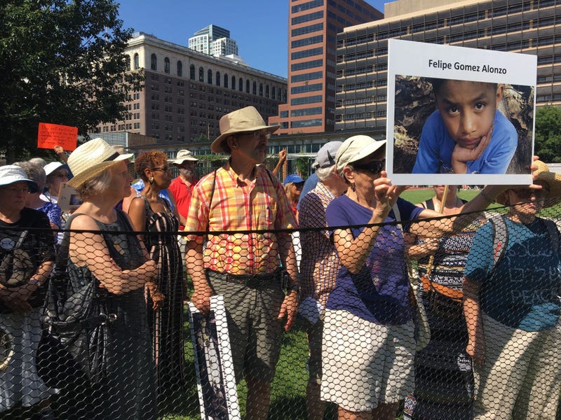 Dozens of seniors packed themselves into a small, makeshift enclosure today, and stood outside in the dangerous heat and humidity to protest migrant family separation and child detention. 