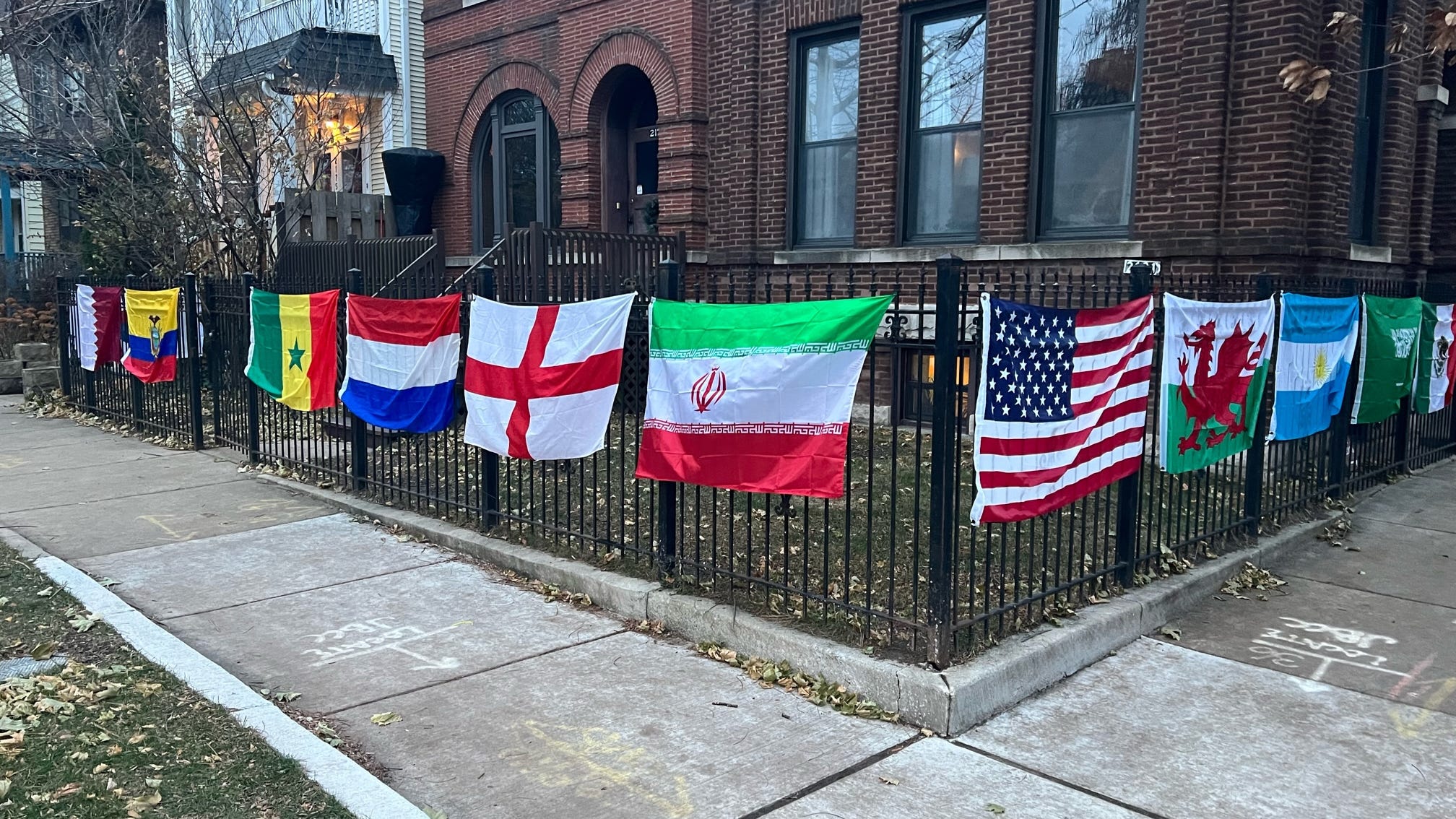 Man hangs flags of countries competing in World Cup outside Lincoln Square home