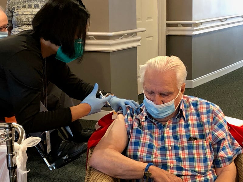 Long-term care facility residents roll up sleeves for COVID-19 booster shots 