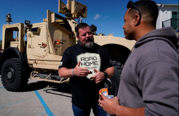 Reg McCutcheon talks to a military veteran