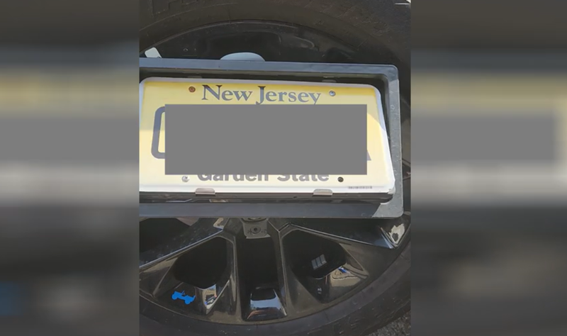 The electronic device flipped the license plate in order to conceal it at the toll plaza, police said