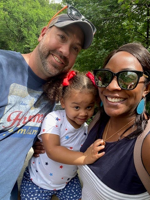 Kelle and Bryan Wolle with one of their foster children.