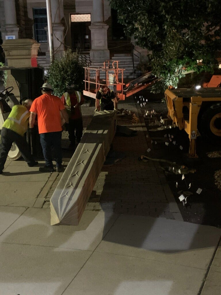 The top of the Confederate monument in Decatur Square was the first portion removed