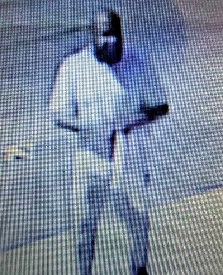 A surveillance photo of someone whom police say struck two young girls and a man with a truck in West Philadelphia on Friday, then fled the scene.