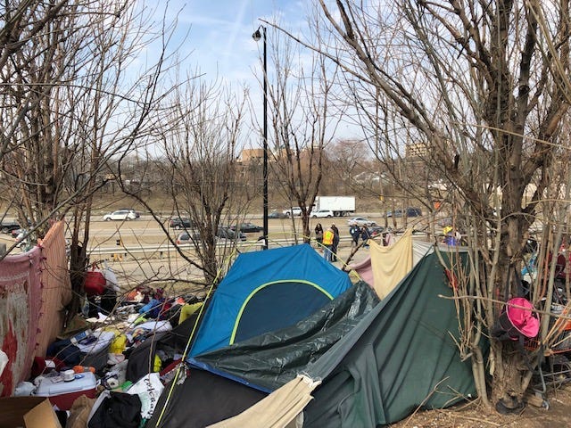 This is spring cleaning day at the homeless encampment along the Dan Ryan Expressway near Roosevelt Road, but the city is not permanently removing the residents.