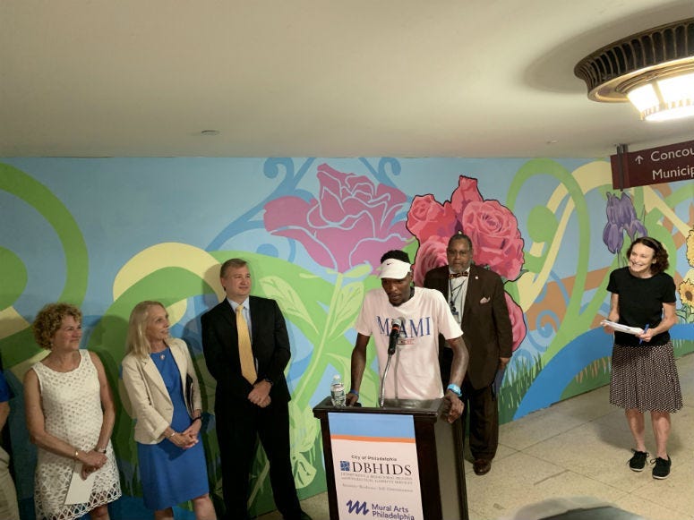 Officials unveiled a new mural in Septa's suburban station Tuesday, but the artwork was only part of the story. The mural is the product of a program to reduce panhandling by providing low barrier jobs that offer same-day pay.