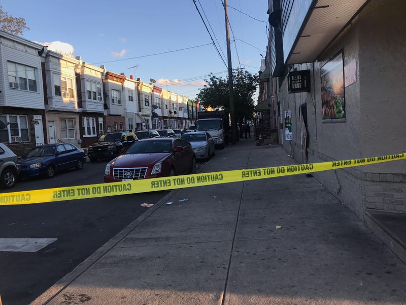 The scene near 7th and West Porter streets after an off-duty officer shot a man who lunged at him with a pair of scissors, according to police.