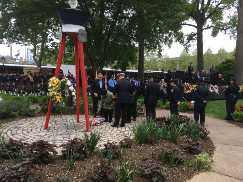 Another name is added to the Living Flame Memorial at Franklin Square Park as each year, the service honors police officers and firefighters who have died in the line of duty.