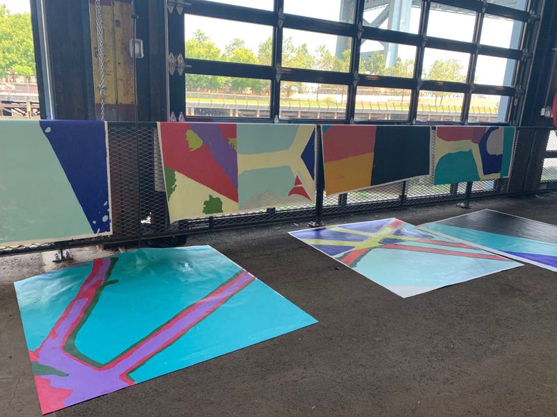 Members of the public were invited to help paint sections of a mural at Cherry Street Pier.