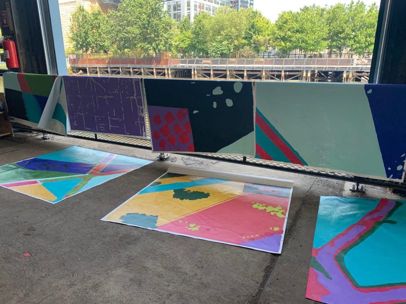 Members of the public were invited to help paint sections of a mural at Cherry Street Pier.