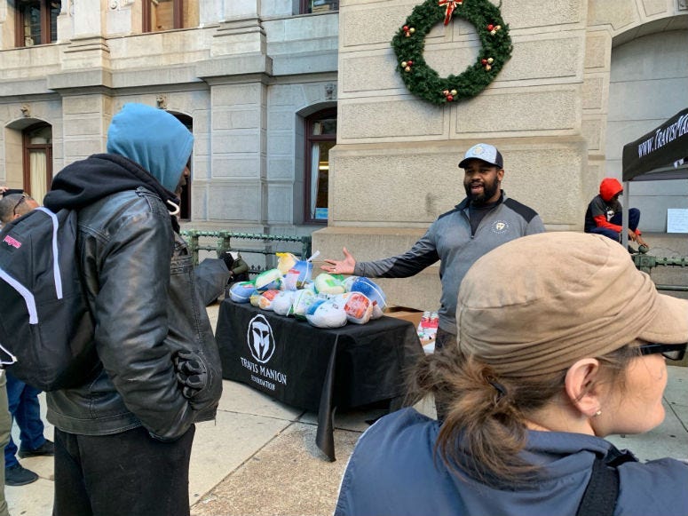 Jimmy White opens the turkey giveaway pop-up at City Hall.
