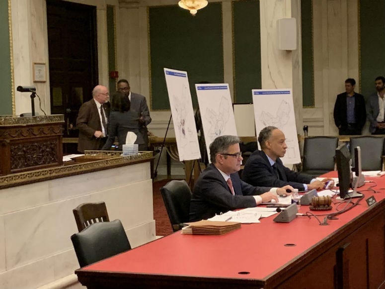 Philadelphia Councilmembers huddle during the 3.5 hour public hearing.