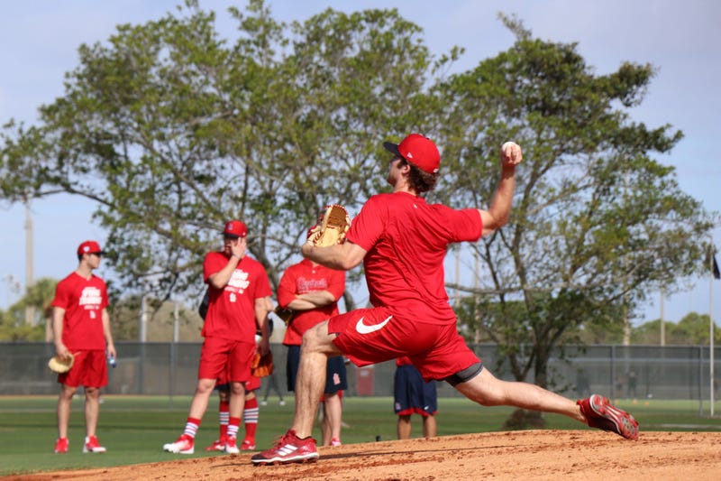 Minor league pitcher Jake Woodford throws a bullpen session.