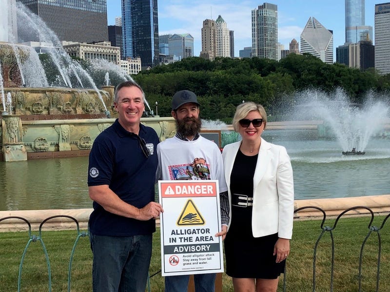 Frank Robb, alligator wrangler, turns on Buckingham Fountain
