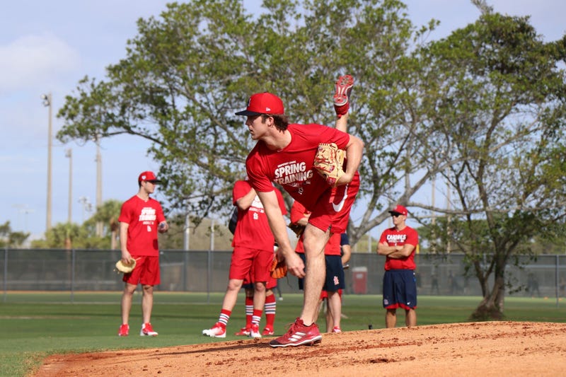 Minor league pitcher Jake Woodford throws a bullpen session.