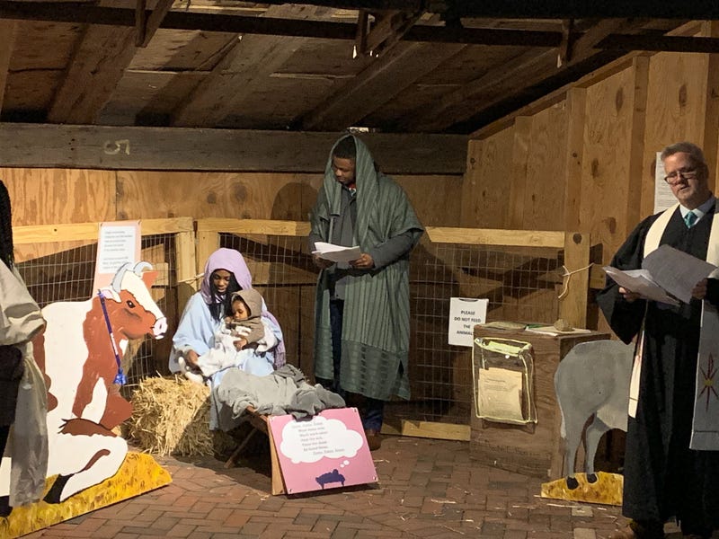 Mary, Joseph, a donkey and more than two dozen carolers took to the streets of Old City Christmas Eve evening, asking neighbors for a place the couple could stay. 