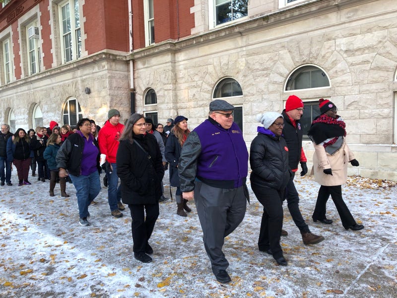 Chicago Teachers Union President Jesse Sharkey joined SEIU Local 73 President Dian Palmer as they walked together, along with others including some parents, into Yates Elemtary School.