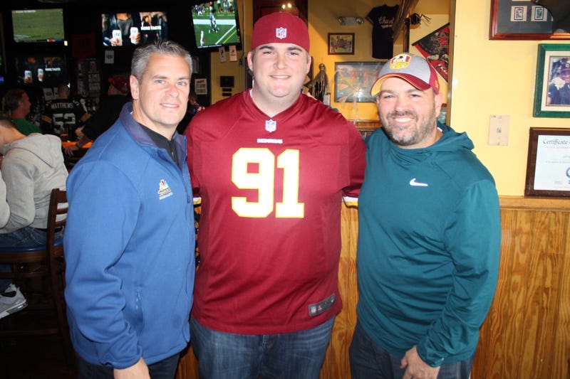 JP and Cakes from The Sports Junkies as well as 106.7 The Fan Street Team, chats with Skins fans at Glory Days Grill in Centreville, Va before kickoff.