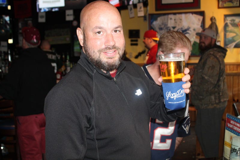 JP and Cakes from The Sports Junkies as well as 106.7 The Fan Street Team, chats with Skins fans at Glory Days Grill in Centreville, Va before kickoff.