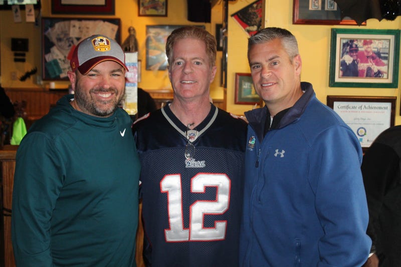 JP and Cakes from The Sports Junkies as well as 106.7 The Fan Street Team, chats with Skins fans at Glory Days Grill in Centreville, Va before kickoff.
