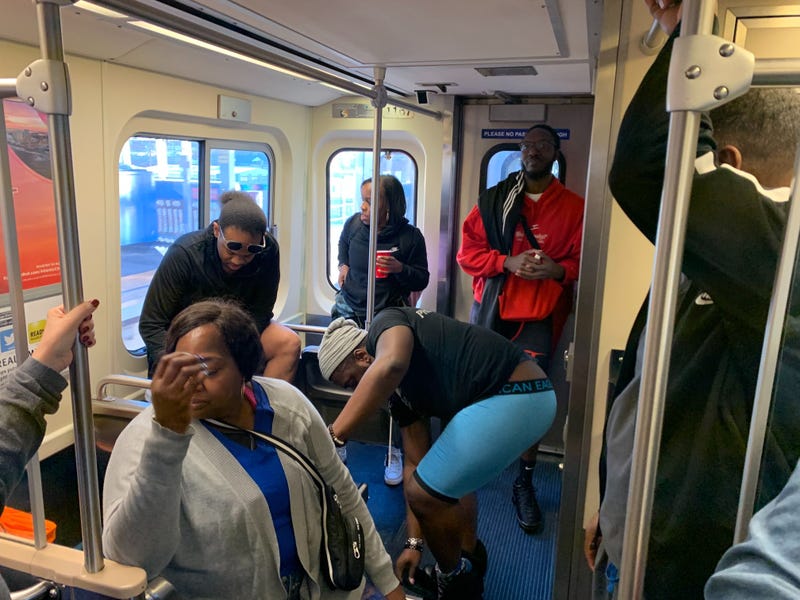 A Market-Frankford Line rider looks away as fellow passengers take part in the No Pants Subway Ride to benefit the homeless.