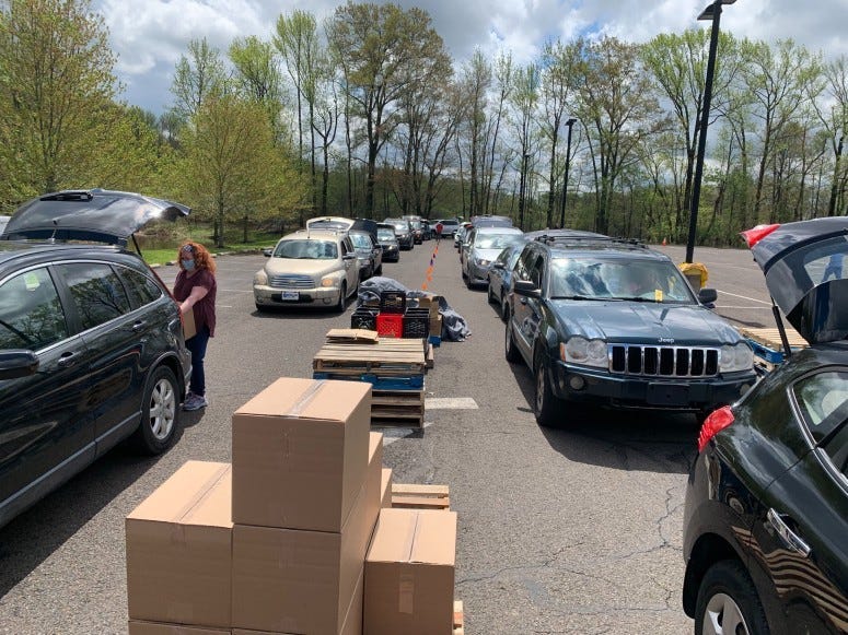 Staffers and volunteers with the Bucks County Opportunity Council provided boxes of food for those in need