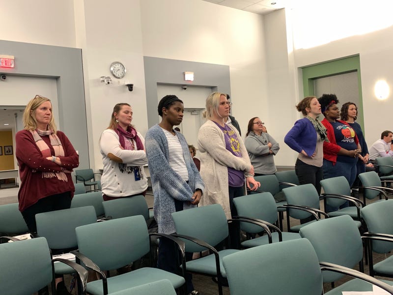achers at McClure Elementary School stand as the school board considers having them make up asbestos days over spring break.