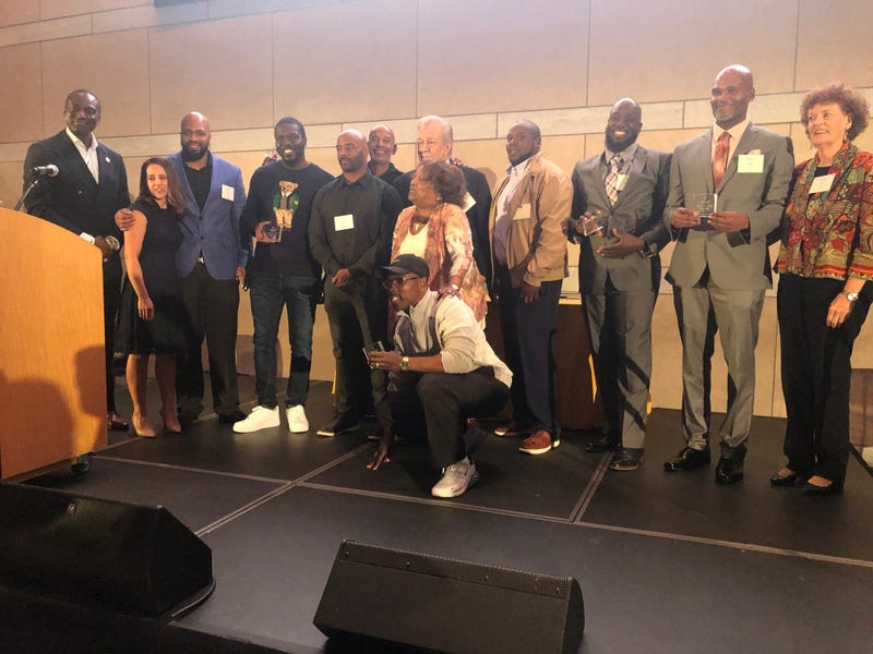 Dr. Yusef Salaam (left) with Innocence Project leaders and exonerees