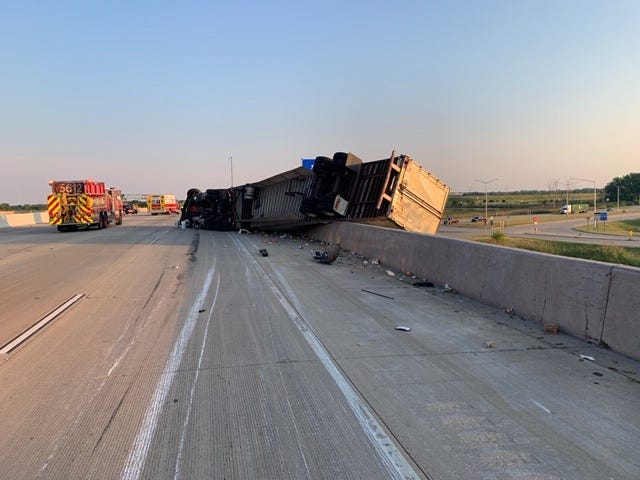 A semitrailer hangs over a retaining wall following a crash June 17, 2020, in the 9000 block of I-94.