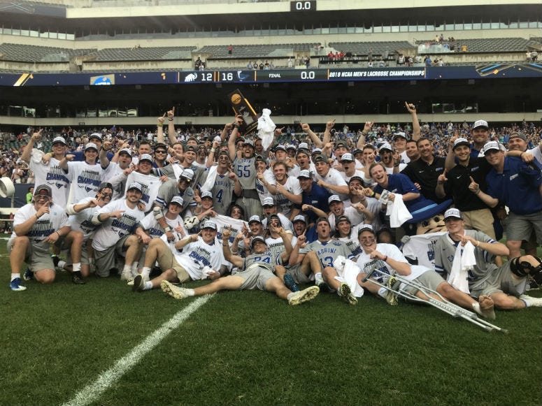The Cabrini University men's lacrosse team celebrates its first national title at the Linc on Sunday.