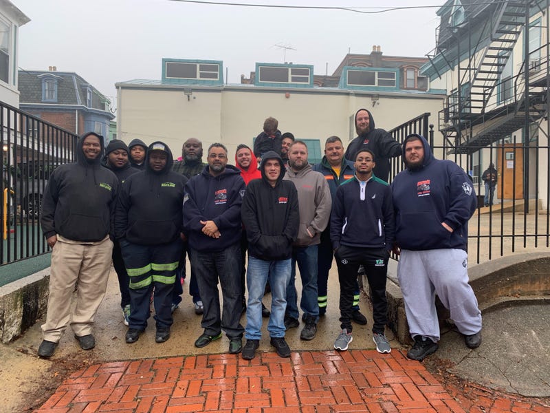 The Tows for Tots drivers, including Charles Norton, who organized the donation effort.