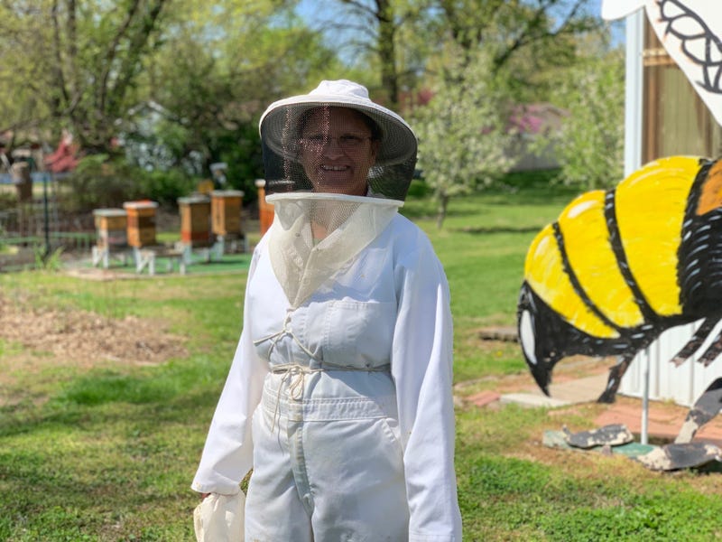 Julie McKinney prepares to inspect her hives