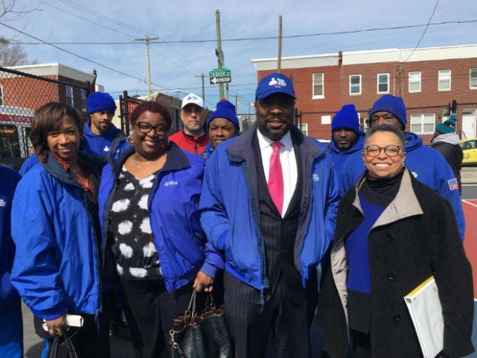 Councilman Kenyatta Johnson with Urban League director Charlene Matlock Turner and workers and officials from Ready, Willing and Able.