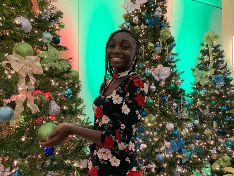 Grace admires the Christmas trees at the KYW Newsradio broadcast center